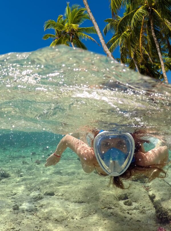 snorkeling-near-tropical-island-beautiful-girl-swims-water-sea-vacation copia