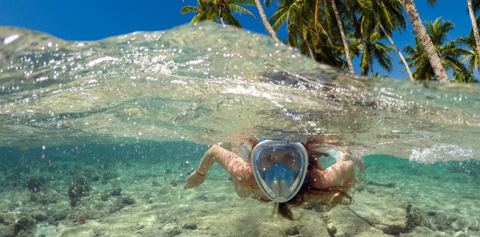 snorkeling-near-tropical-island-beautiful-girl-swims-water-sea-vacation copia